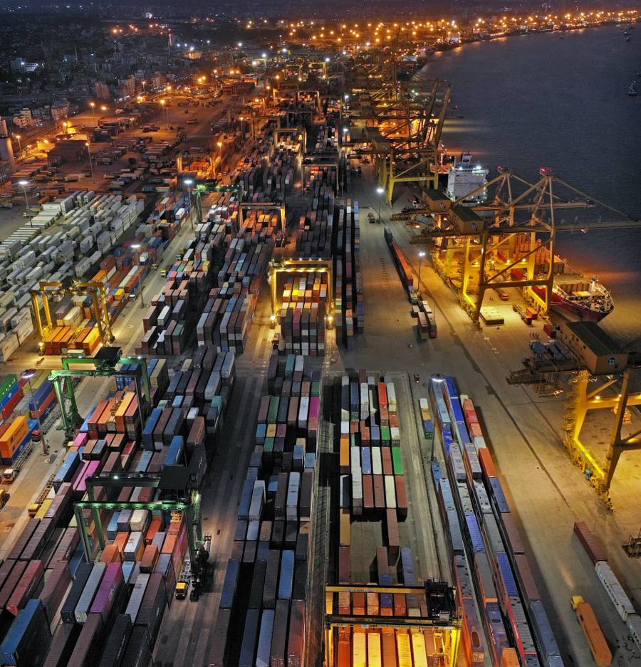 Aerial night view of a busy container port terminal